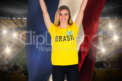 Excited football fan in brasil tshirt holding netherlands flag