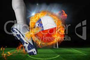 Football player kicking flaming chile flag ball