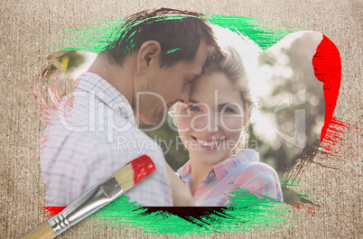 Composite image of happy couple in the countryside