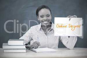 Happy teacher holding page showing online degree