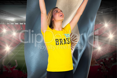 Excited football fan in brasil tshirt holding argentina flag