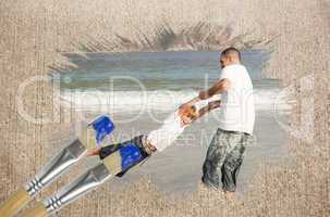 Composite image of father and son on the beach