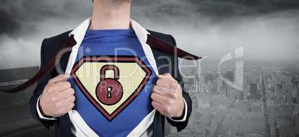 Composite image of businessman opening shirt in superhero style