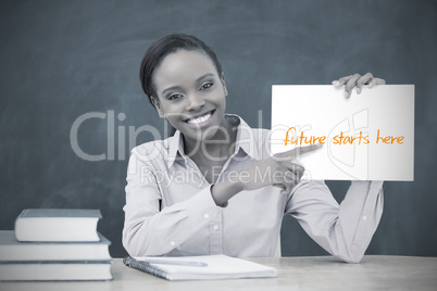 Happy teacher holding page showing future starts here