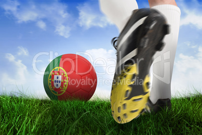 Football boot kicking portugal ball
