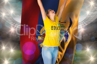 Excited football fan in brasil tshirt holding ecudaor flag