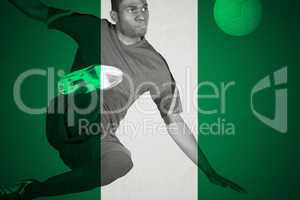 Football player in green kicking