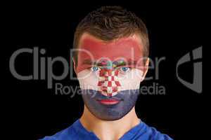 Serious young croatia fan with facepaint