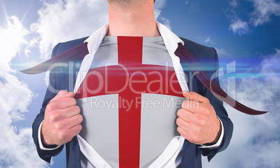 Businessman opening shirt to reveal england flag