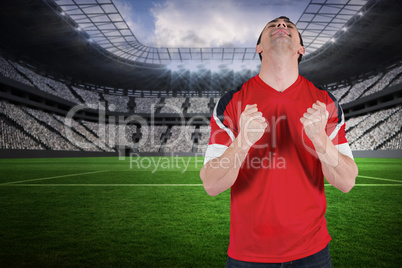 Excited football fan cheering