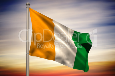 Ivory coast national flag on flagpole