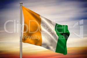 Ivory coast national flag on flagpole