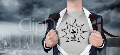 Composite image of businessman opening shirt in superhero style