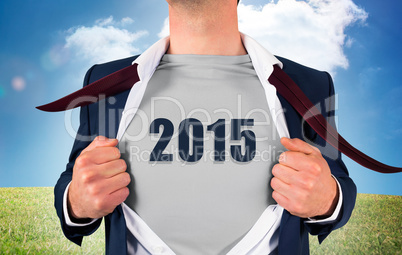 Composite image of businessman opening shirt in superhero style