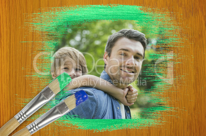 Composite image of father and son in the park