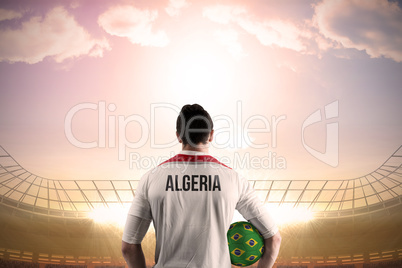 Algeria football player holding ball