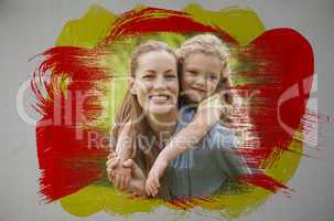 Composite image of smiling mother and daughter in the park
