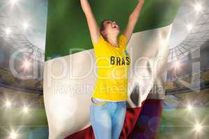 Excited football fan in brasil tshirt holding italy flag