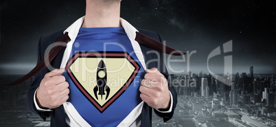 Composite image of businessman opening shirt in superhero style