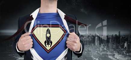 Composite image of businessman opening shirt in superhero style