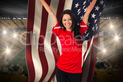 Cheering football fan in red holding usa flag