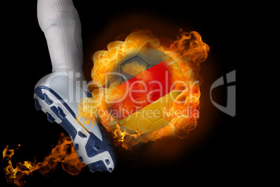 Football player kicking flaming germany ball