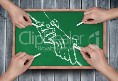 Composite image of multiple hands drawing handshake with chalk