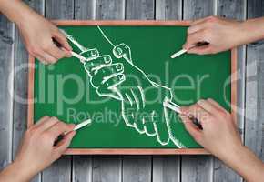 Composite image of multiple hands drawing handshake with chalk