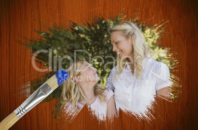 Composite image of mother and daughter in the park