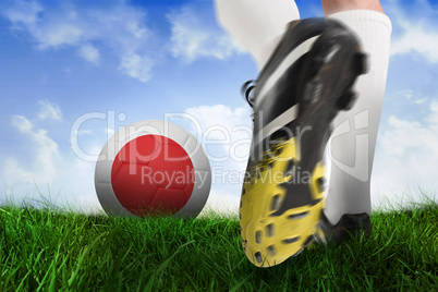 Football boot kicking japan ball