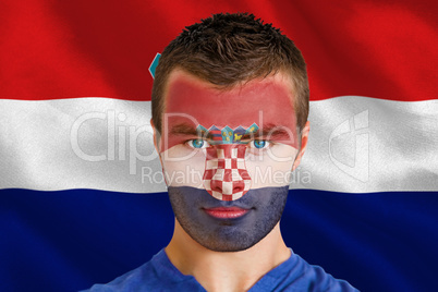 Serious young croatia fan with facepaint