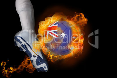 Football player kicking flaming australia ball