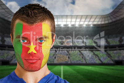 Cameroon football fan in face paint