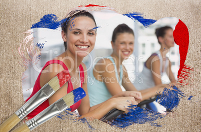 Composite image of spinning class in the gym