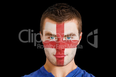 Serious young england fan with facepaint