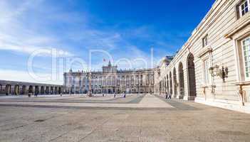 Royal palace with tourists on spring day in Madrid