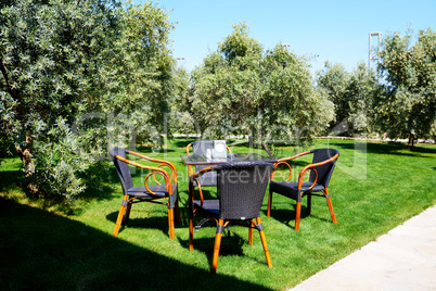 The chairs and table are on lawn in luxury hotel, Antalya, Turke