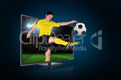 Football player kicking ball through tv