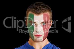 Serious young italy fan with facepaint