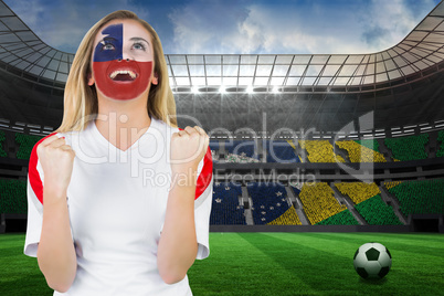 Excited chile fan in face paint cheering
