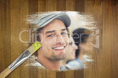 Composite image of smiling designer