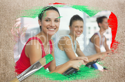 Composite image of spinning class in the gym