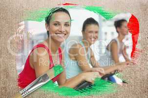 Composite image of spinning class in the gym