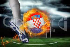 Football player kicking flaming croatia flag ball