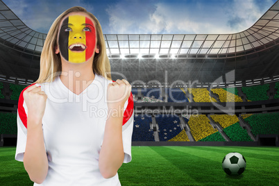 Excited belgium fan in face paint cheering
