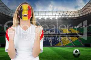 Excited belgium fan in face paint cheering