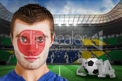 Serious young japan fan with face paint