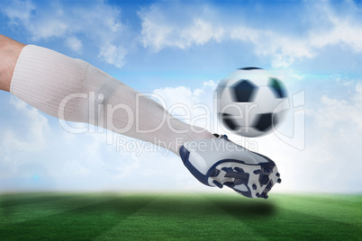 Close up of football player kicking ball