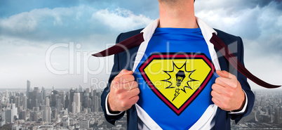 Composite image of businessman opening shirt in superhero style