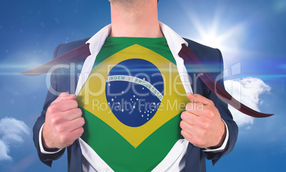 Businessman opening shirt to reveal brasil flag